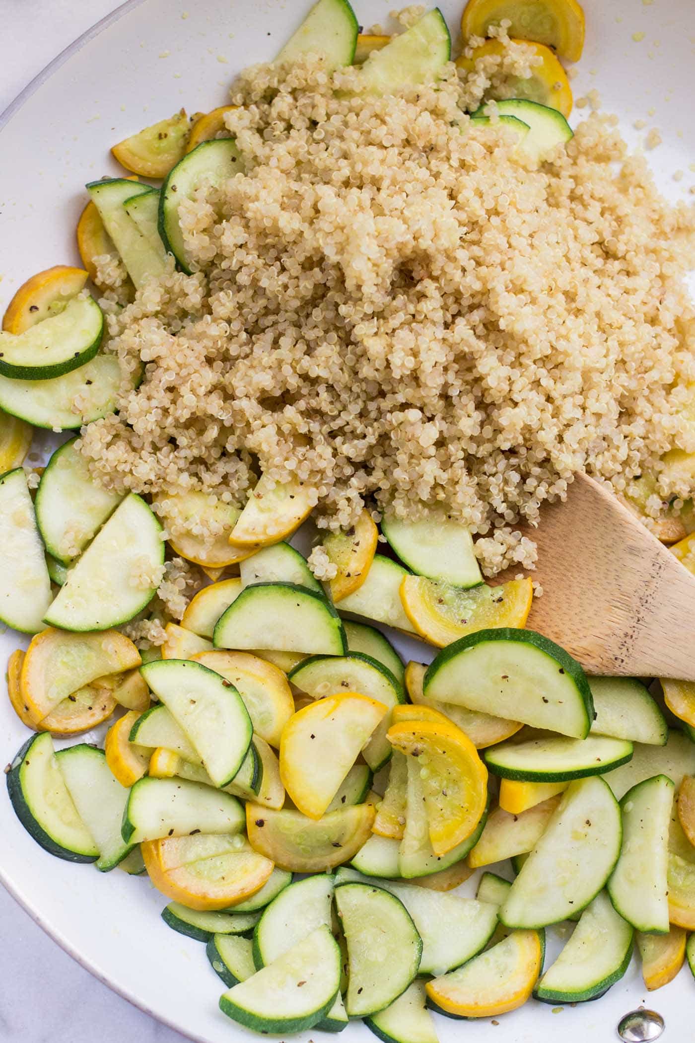 Summer Zucchini Quinoa Salad with warm sauteed vegetables, toasted pine nuts and a dreamy lemon-dill dressing!
