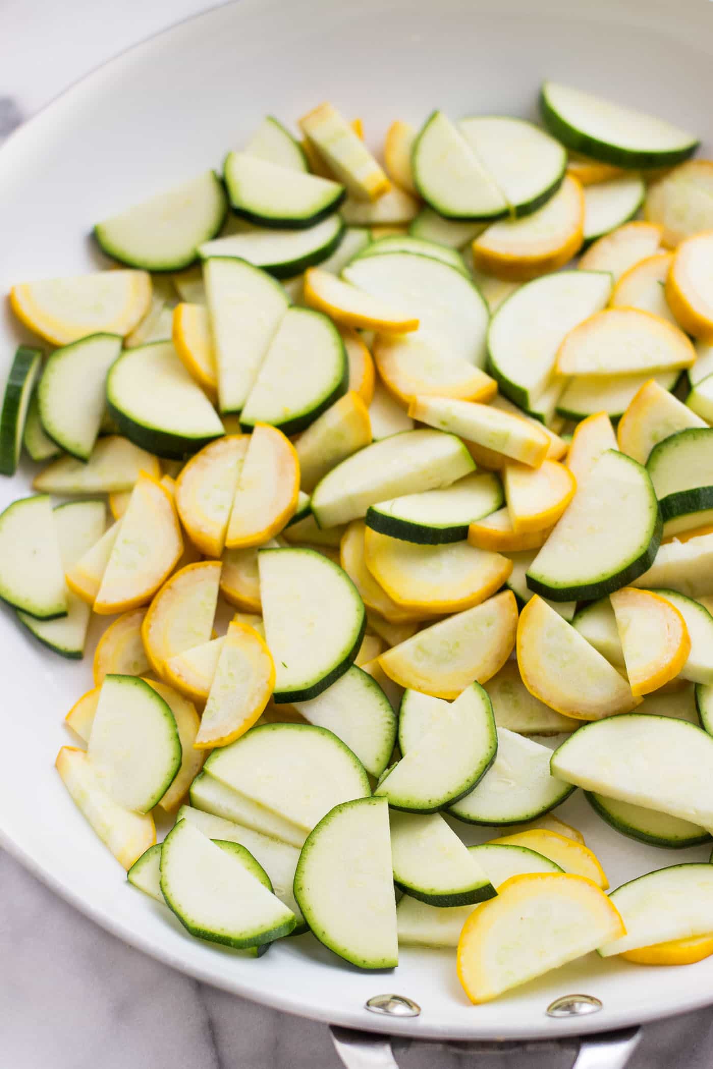 Summer Zucchini Quinoa Salad with warm sauteed vegetables, toasted pine nuts and a dreamy lemon-dill dressing!