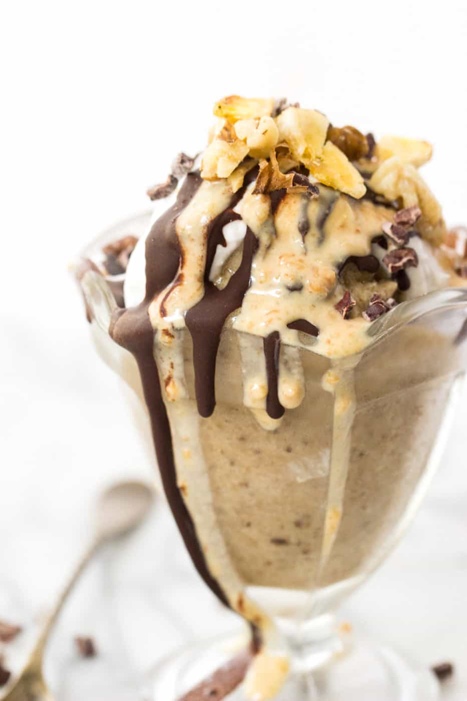 VEGAN BANANA ICE CREAM SUNDAY -- base of banana ice cream, topped with coconut whipped cream, vegan chocolate sauce, creamy peanut butter and nuts!