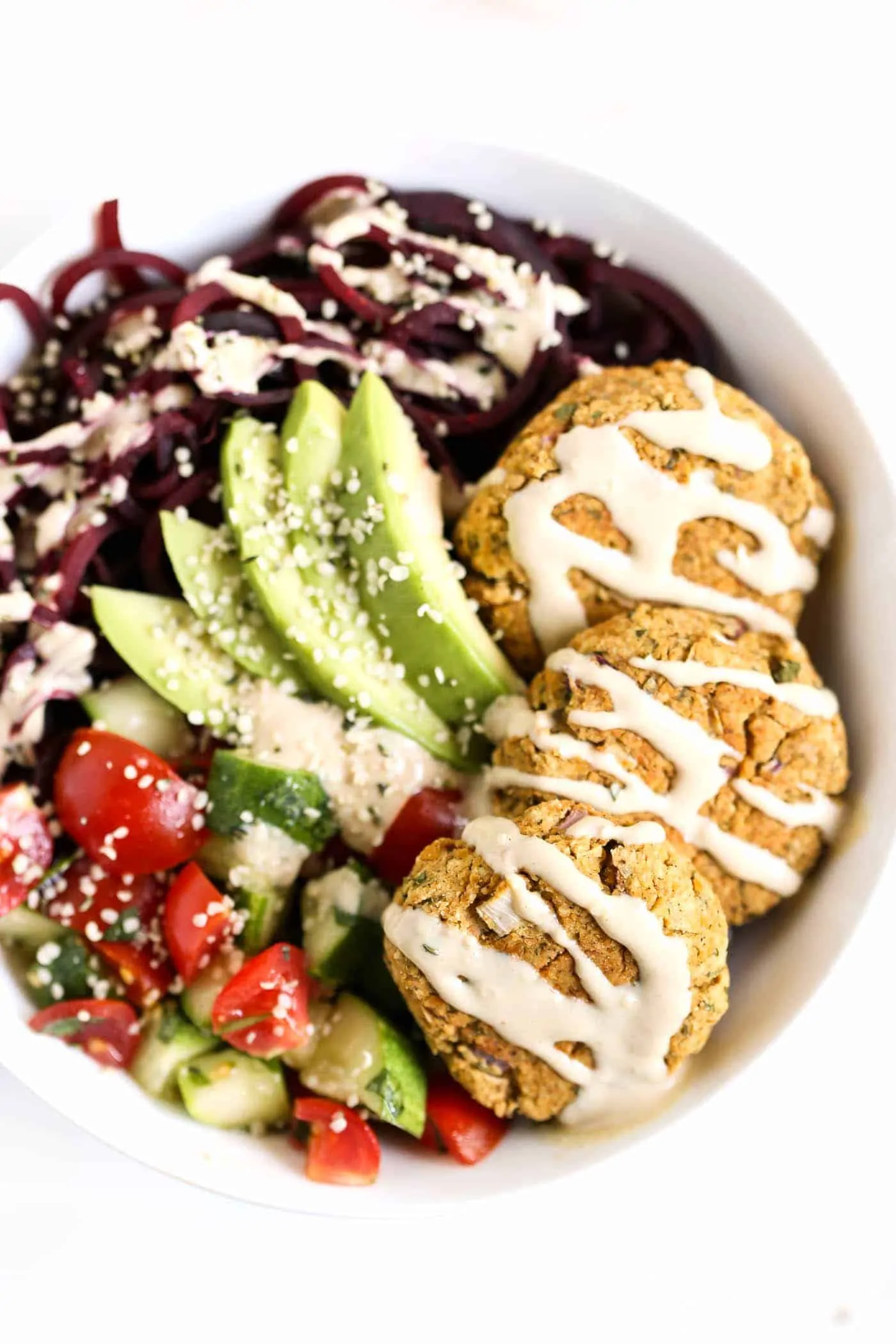 EASY BAKED FALAFEL BOWLS with roasted beet noodles and a creamy tahini dressing [VEGAN]