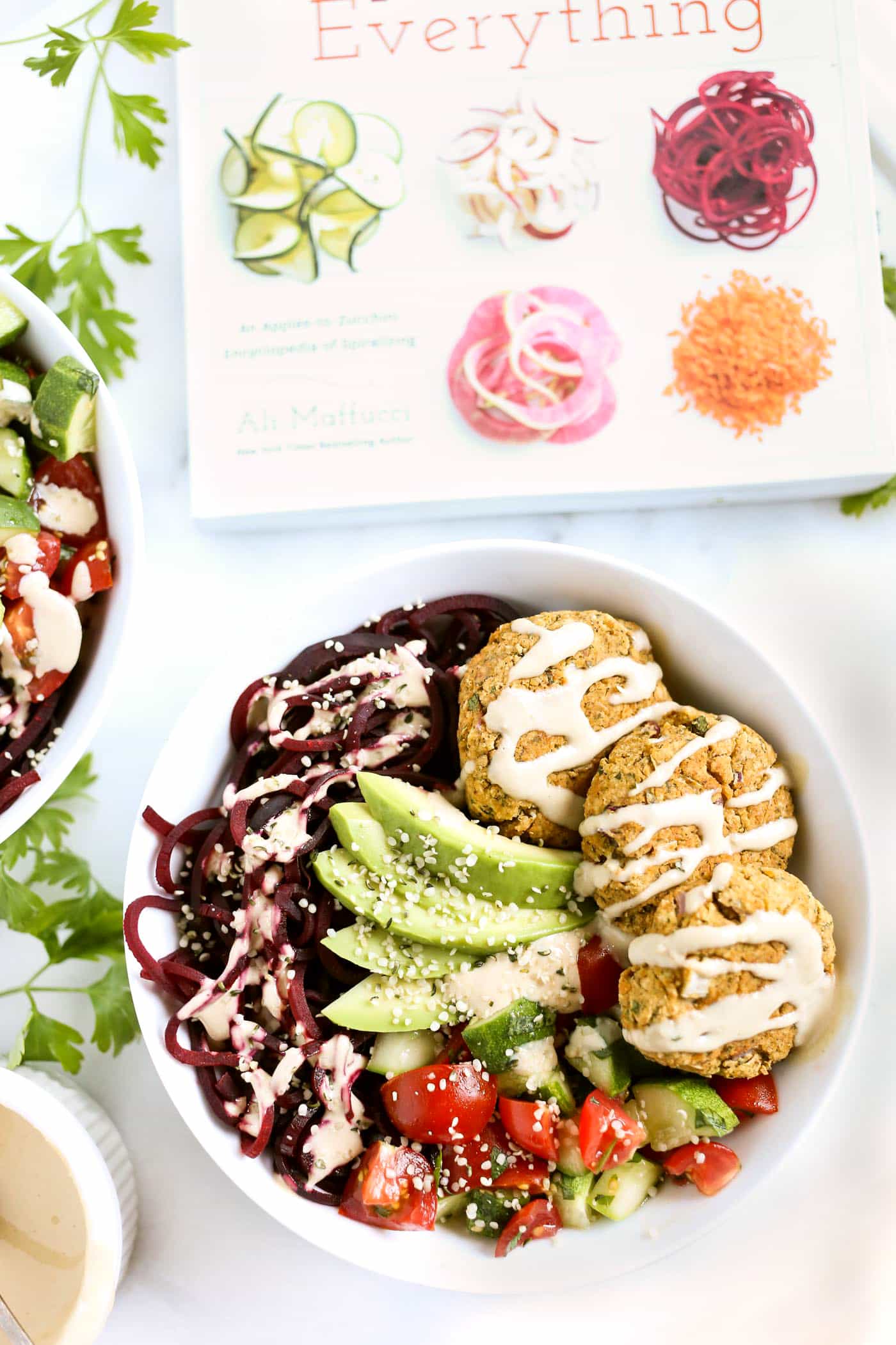 VEGETARIAN FALAFEL BOWLS with beet noodles. cucumbers, tomatoes and a creamy tahini dressing! 