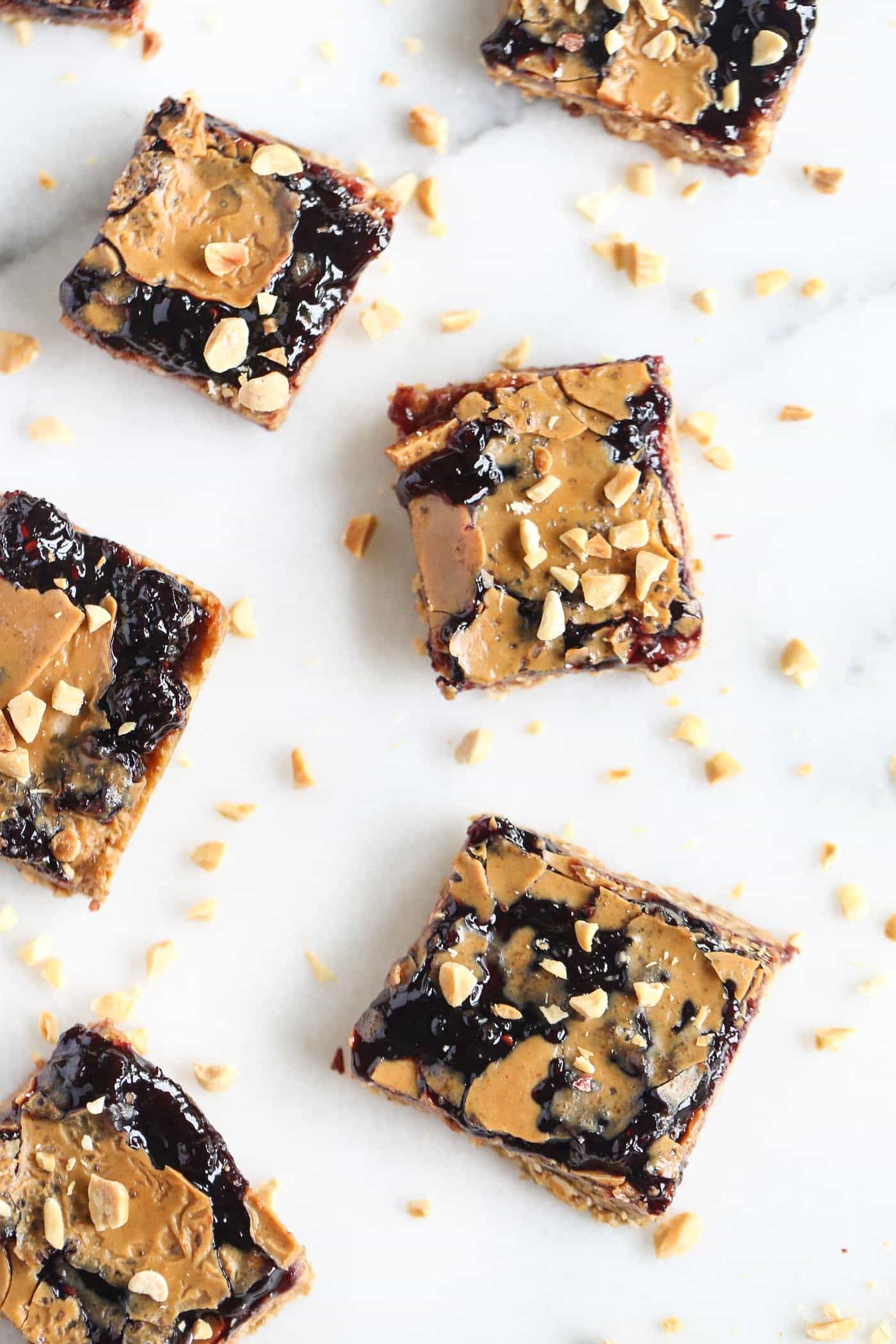 Need an afternoon pick-me-up? These PB&J Snack Bars are AMAZING! packed with nutrition, only 8 ingredients and so simple to make!