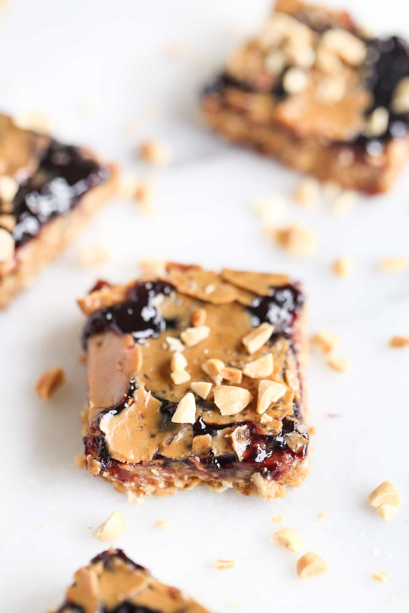 Need an afternoon pick-me-up? These PB&J Snack Bars are AMAZING! packed with nutrition, only 8 ingredients and so simple to make!