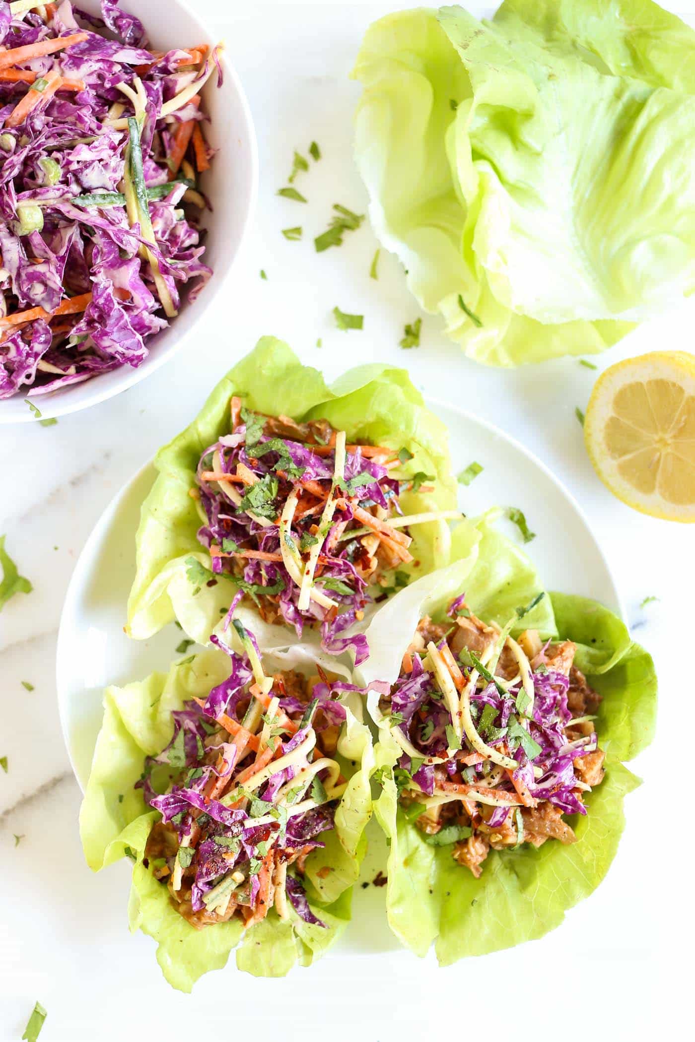BBQ Pulled Pork Lettuce Wraps that are made with a VEGAN "pulled pork" recipe and topped with a maple coleslaw!