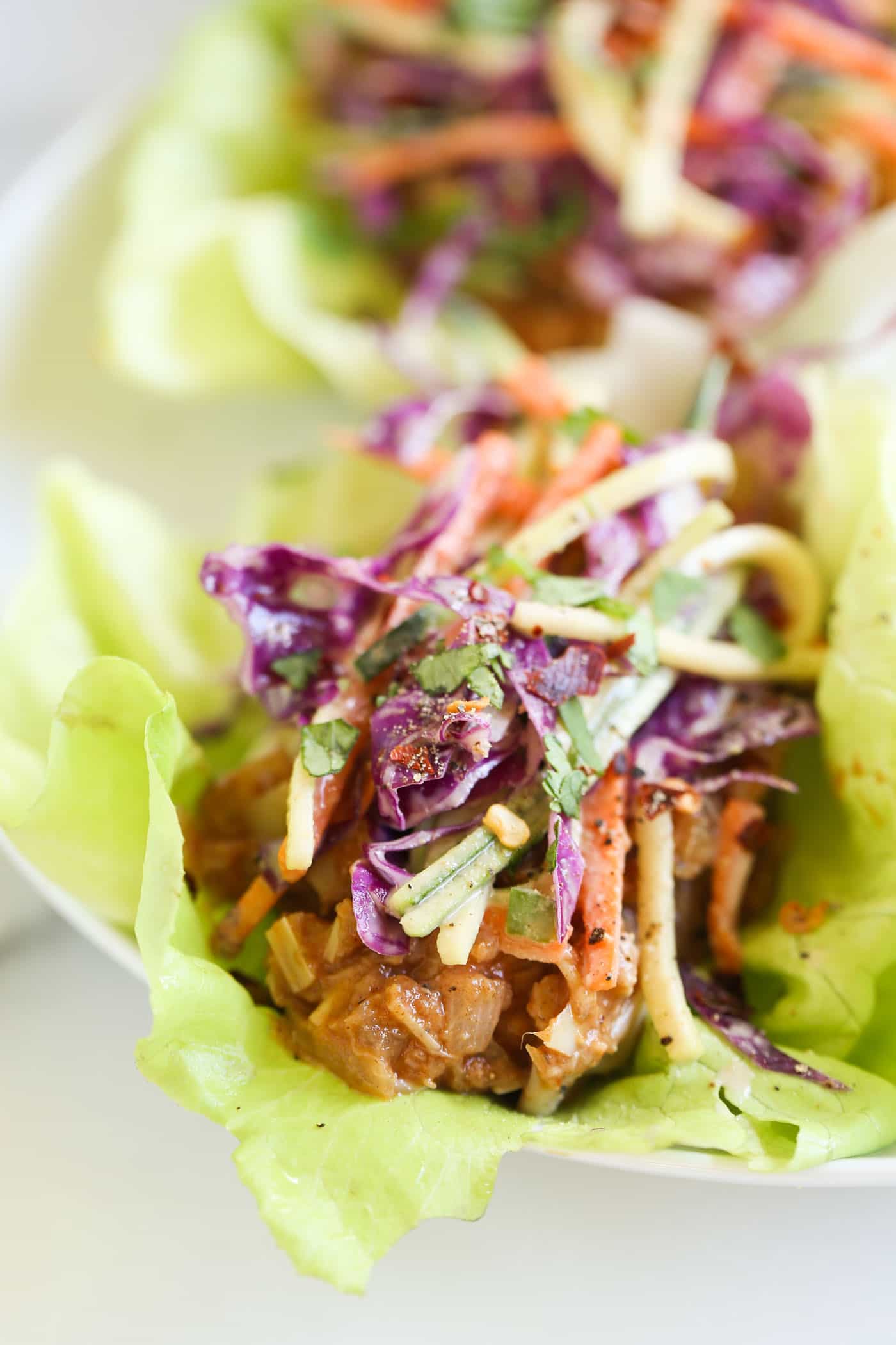 BBQ Pulled Pork Lettuce Wraps that are made with a VEGAN "pulled pork" recipe and topped with a maple coleslaw!