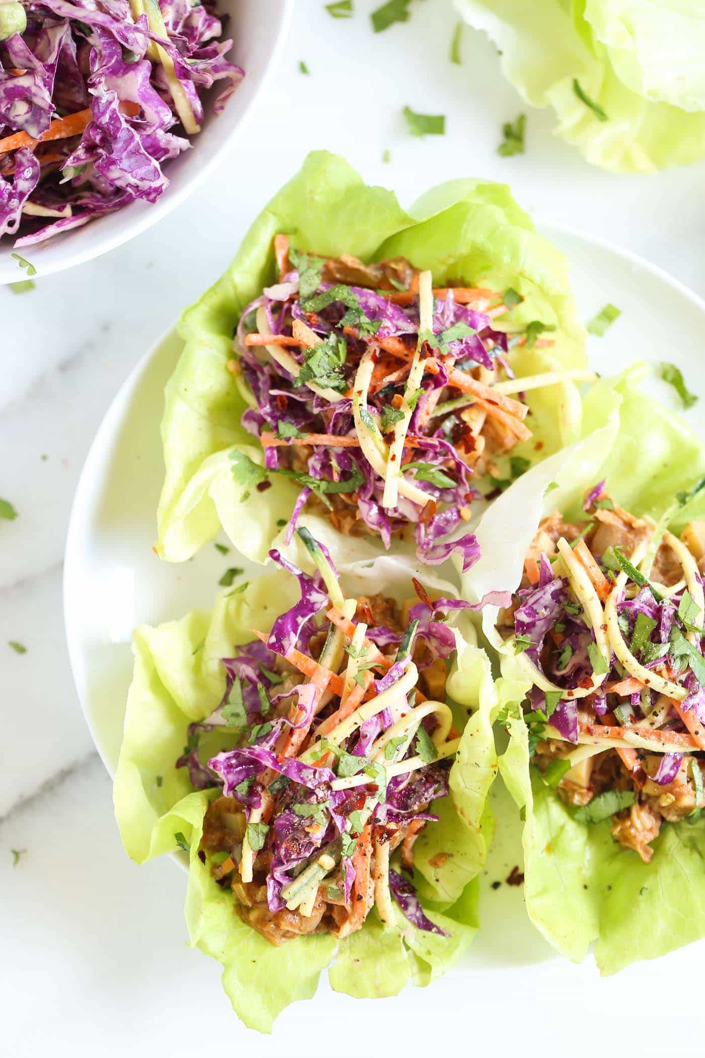 BBQ Pulled Pork Lettuce Wraps that are made with a VEGAN "pulled pork" recipe and topped with a maple coleslaw!