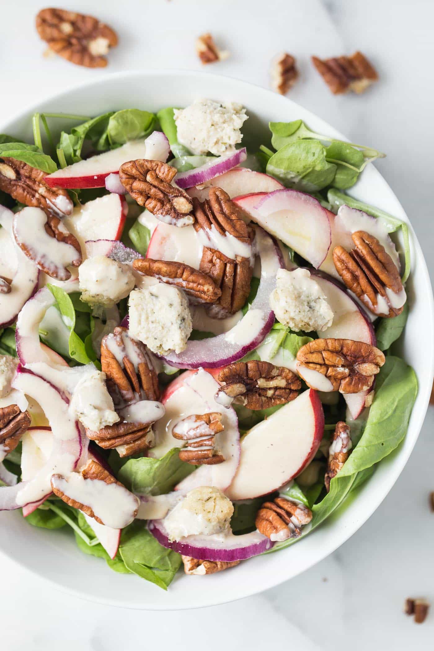 Apple + Pecan Arugula Salad! topped with herbed cashew cheese balls and a maple-tahini dressing!