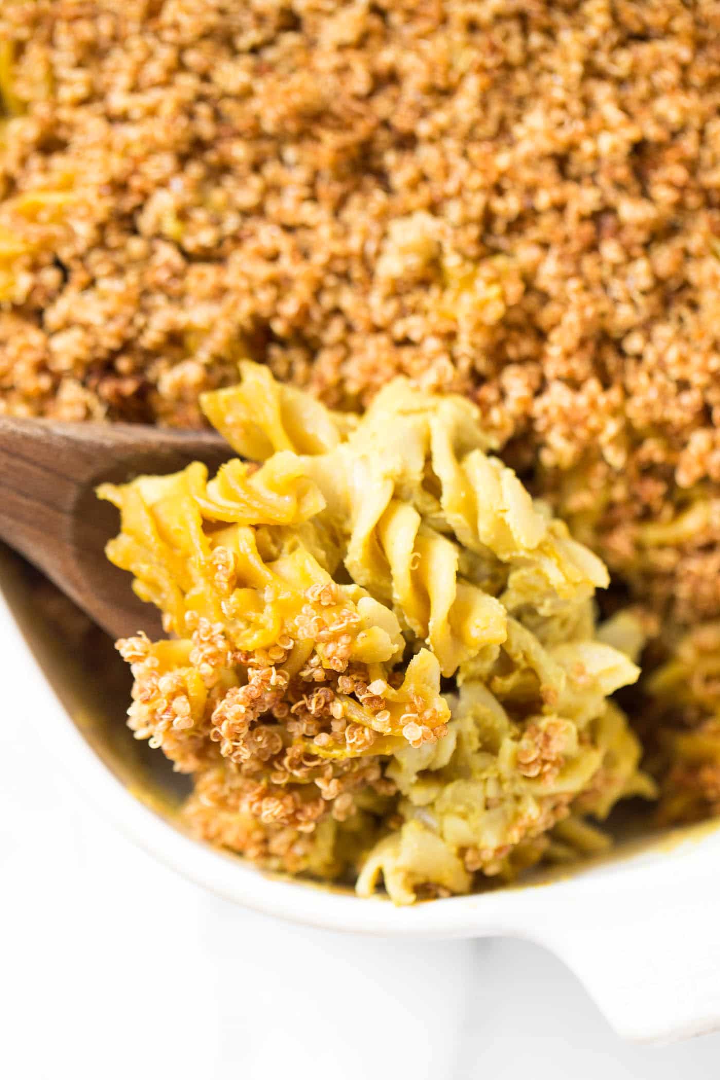 Baked VEGAN Mac and Cheese with a dreamy "cheese" sauce and a crunchy quinoa topping!