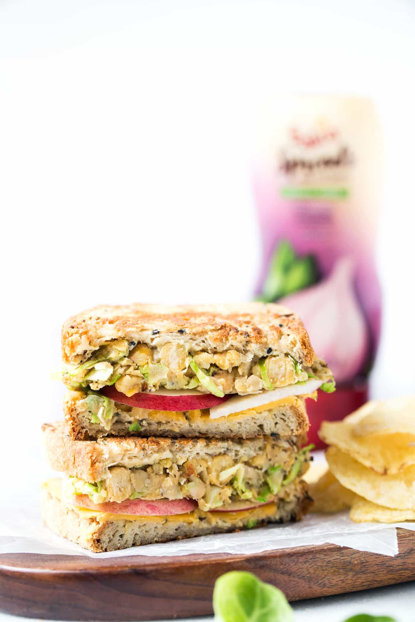 This is hands down THE BEST vegan grilled cheese ever! with brussels sprouts, hummus, apples and more!