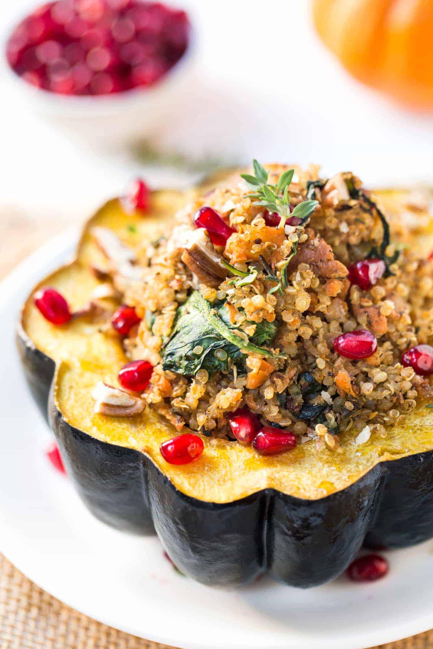 Mushroom & Quinoa Stuffed Acorn Squash with pomegranates and pecans! The perfect winter dish that is packed with plant-based goodness and super easy to prepare [vegan]