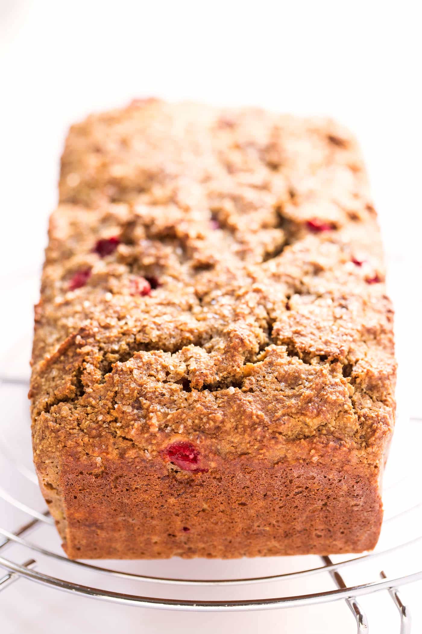 This Cranberry Quinoa Banana Bread is super HEALTHY -- made with quinoa flour, almond flour, banana and sweetened with honey and fresh cranberries!