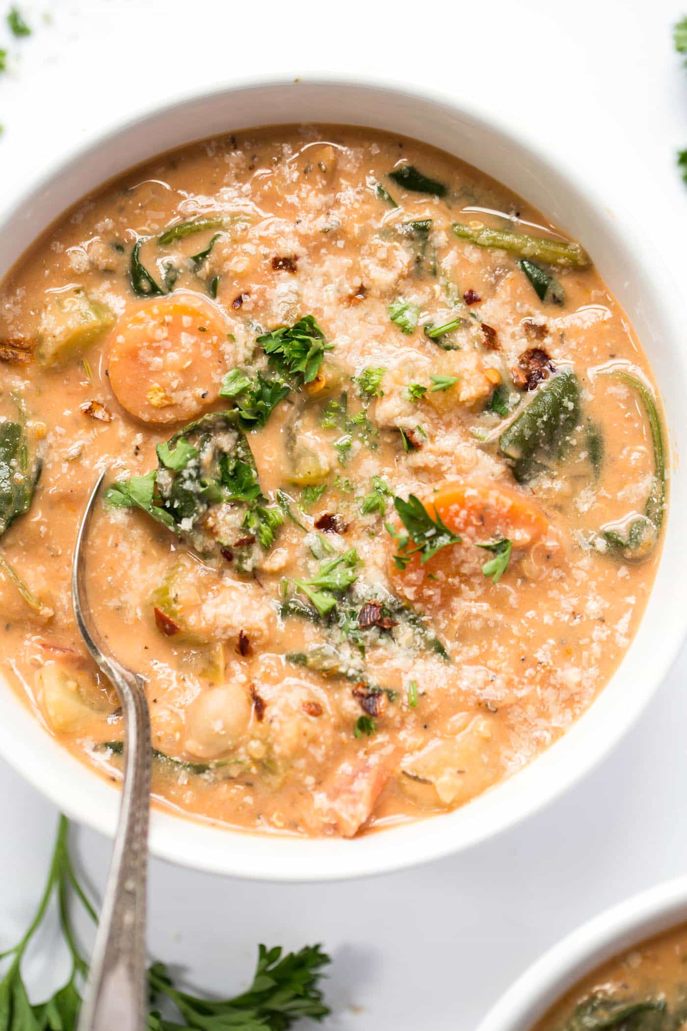 bowl of quinoa soup with nutritional yeast on top