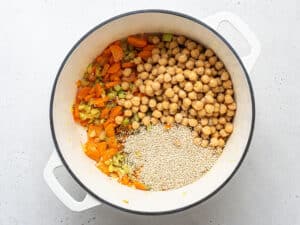 pot of soup with qiunoa, chickpeas and cooked vegetables