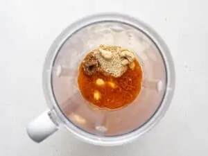 blender with cashew and seasoning for soup