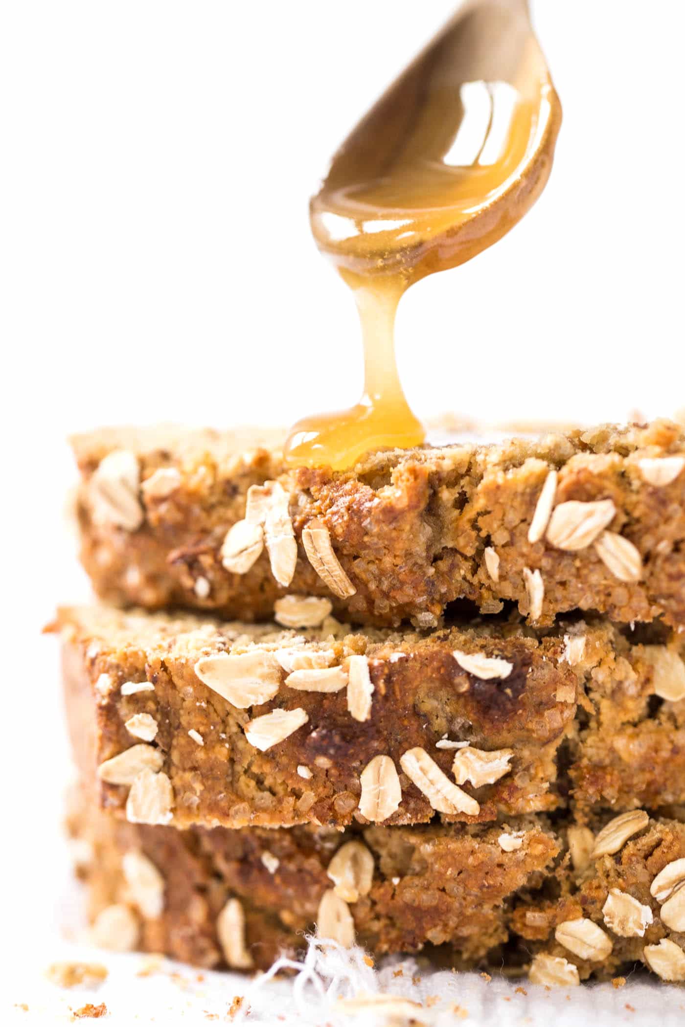 This HEALTHY Honey Oatmeal Banana Bread is packed with nutrient-dense flours, sweetened naturally and uses just one tablespoon of oil!