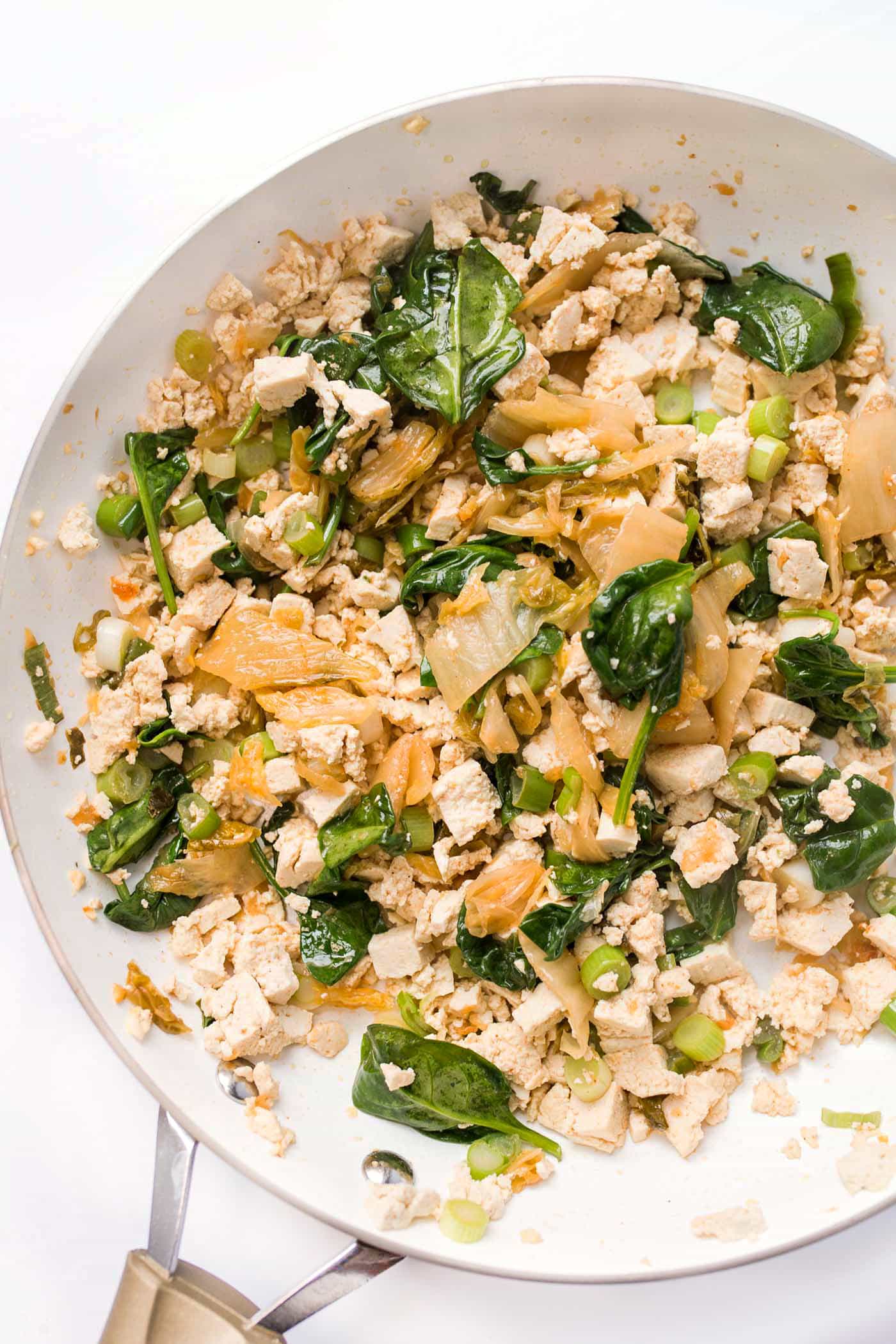 5-Ingredient Tofu Scramble in the making! With kimchi, spinach and green onions for crunch!