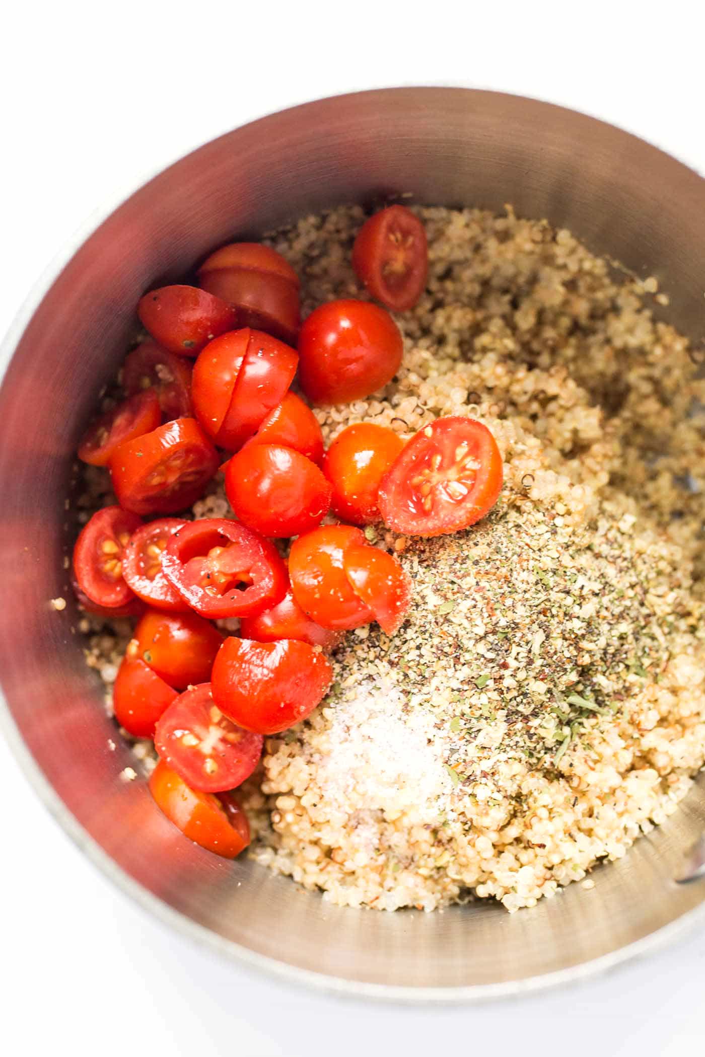 Savory Breakfast Quinoa Bowls with spinach, tomatoes and fried eggs on top!