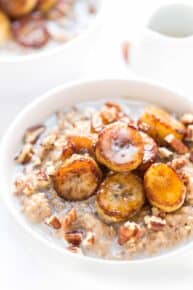 CREAMY STEEL CUT OATS topped with caramelized bananas, pecans and a drizzle of almond milk! [VEGAN]