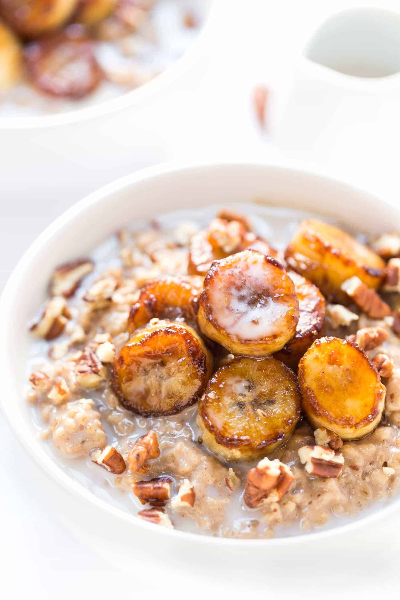 CREAMY STEEL CUT OATS topped with caramelized bananas, pecans and a drizzle of almond milk! [VEGAN]