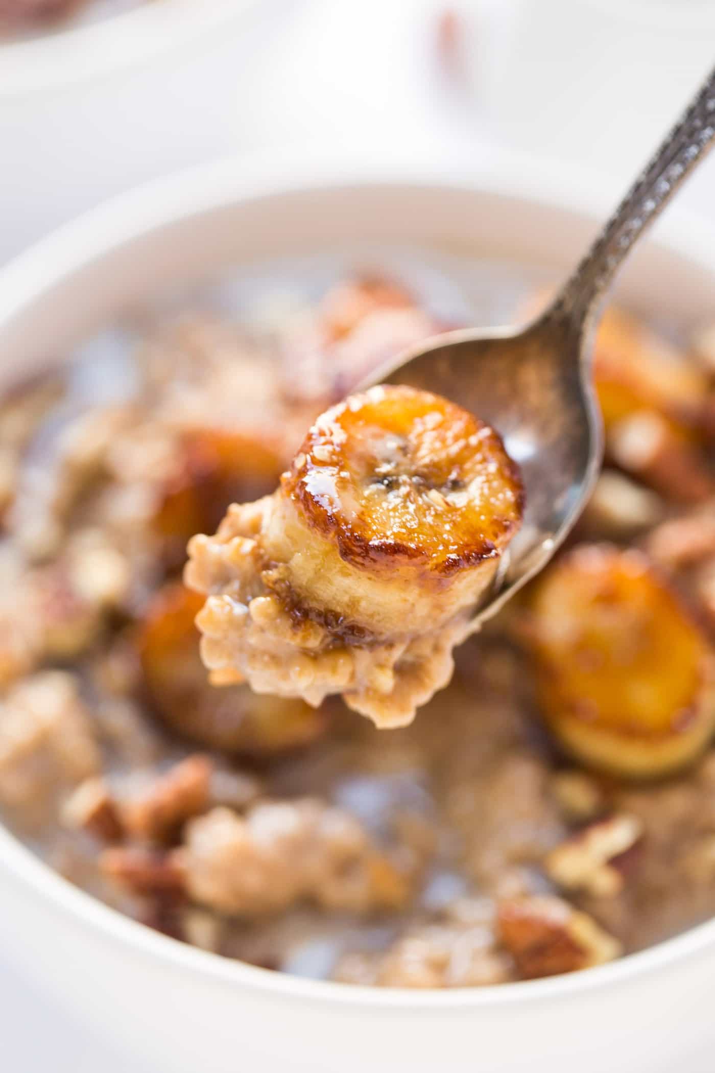 CREAMY STEEL CUT OATS topped with caramelized bananas, pecans and a drizzle of almond milk! [VEGAN]