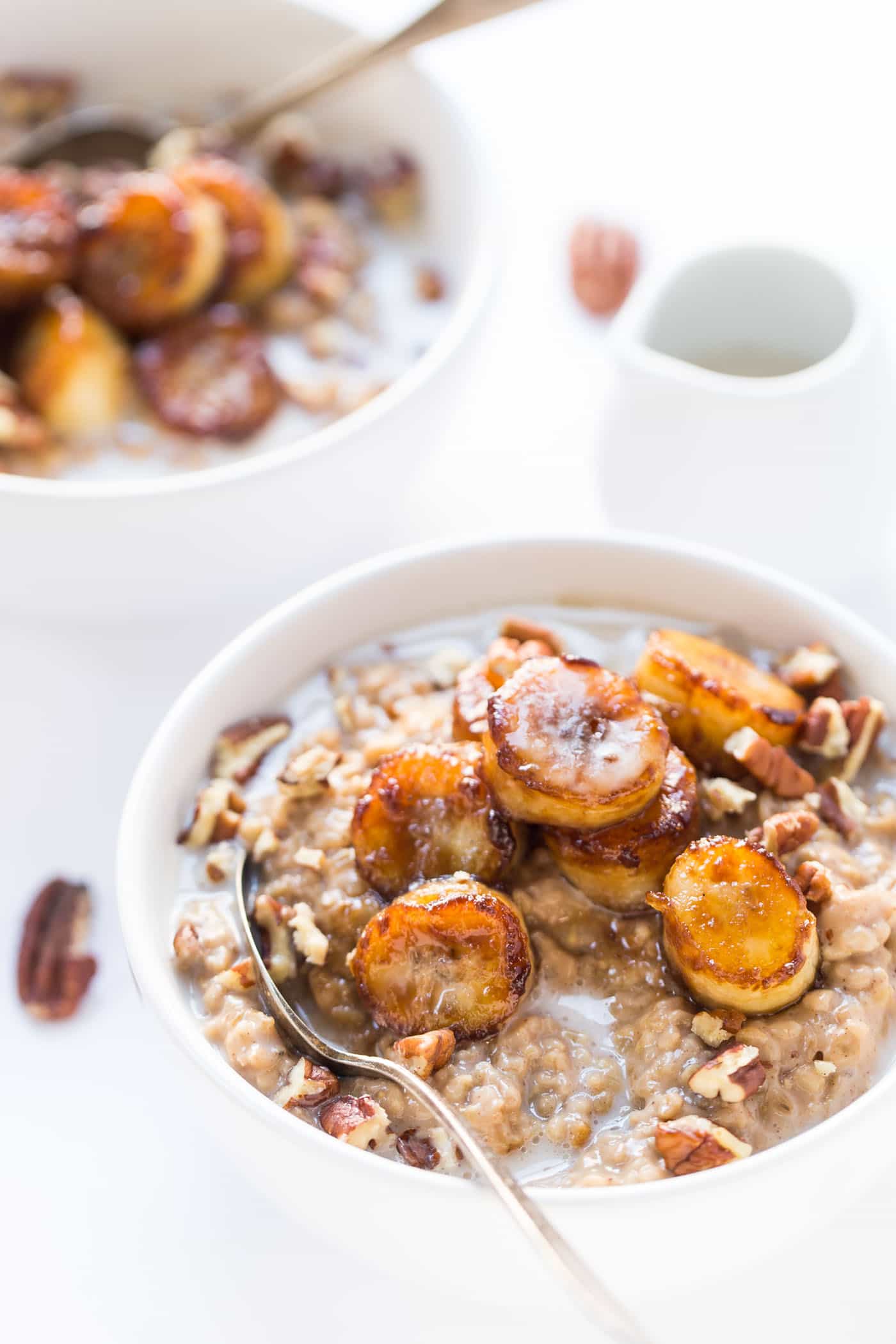 CREAMY STEEL CUT OATS topped with caramelized bananas, pecans and a drizzle of almond milk! [VEGAN]