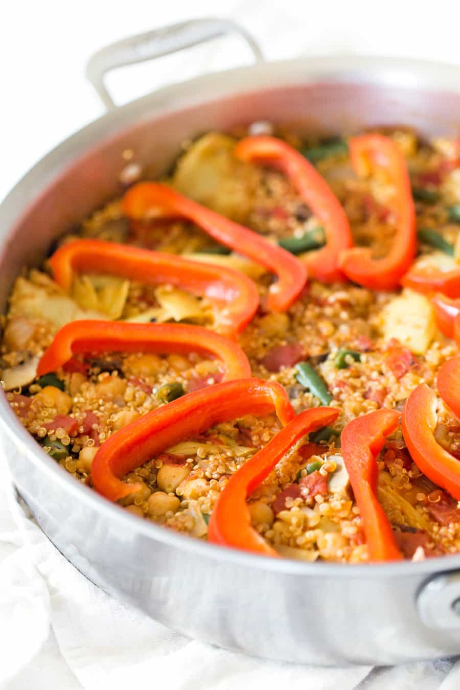 This easy Vegetarian Quinoa Paella is made in just ONE PAN, packed with flavor and is ready in less than 40 minutes!