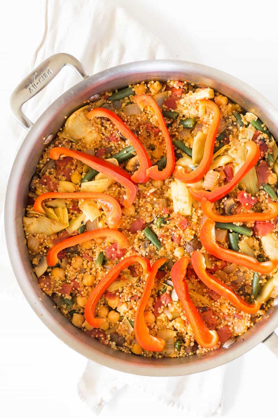 This easy Vegetarian Quinoa Paella is made in just ONE PAN, packed with flavor and is ready in less than 40 minutes!