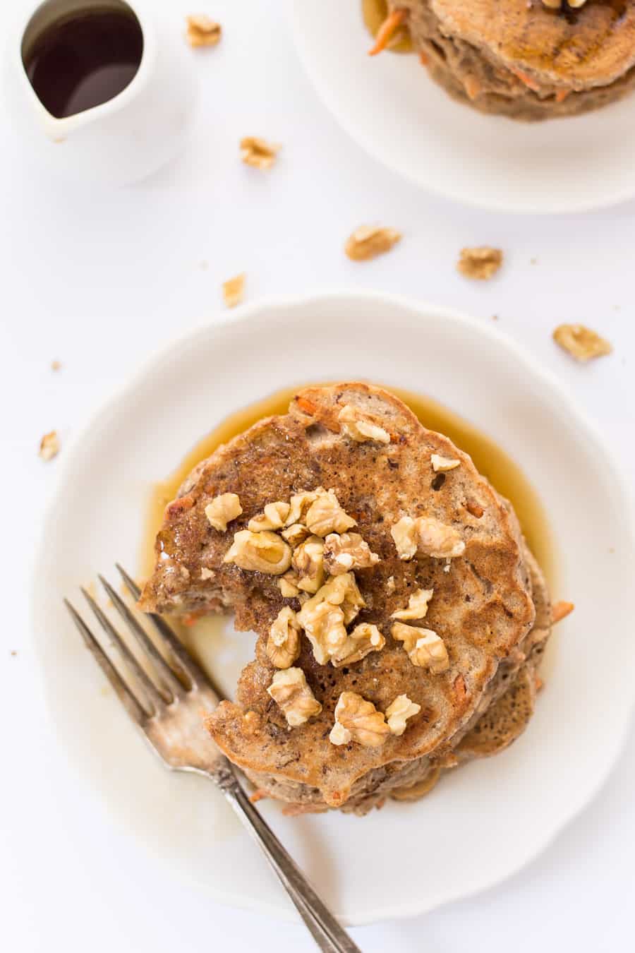 These healthy carrot cake pancakes are packed with nutritious ingredients like quinoa, almond, flax and coconut! The perfect way to kickstart your day with a breakfast that tastes like dessert!