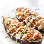 Quinoa Stuffed Eggplant - with mushrooms, tomatoes and a creamy tahini sauce on top! Ready in just 30 MINUTES!