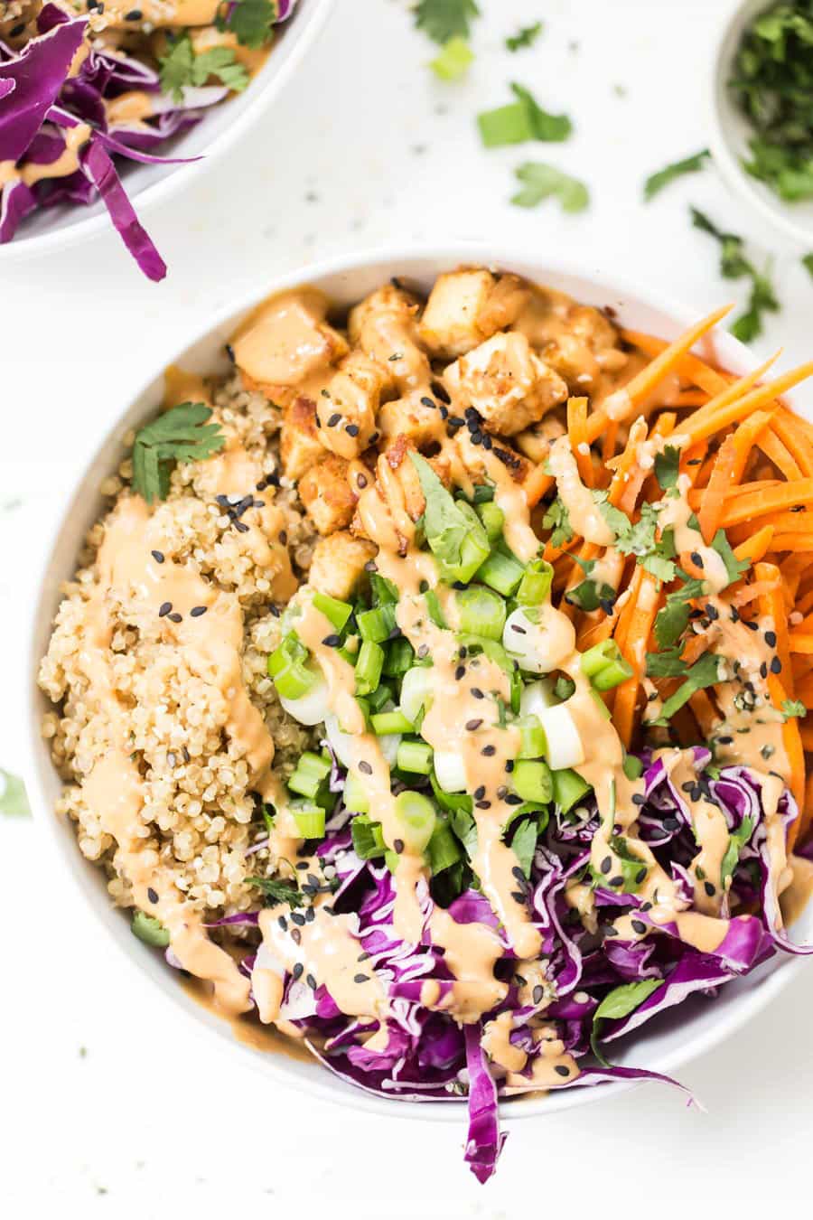 Asian Quinoa Bowls with Peanut Baked Tofu -- use up the veggies in your fridge to whip up this TASTY bowl meal!