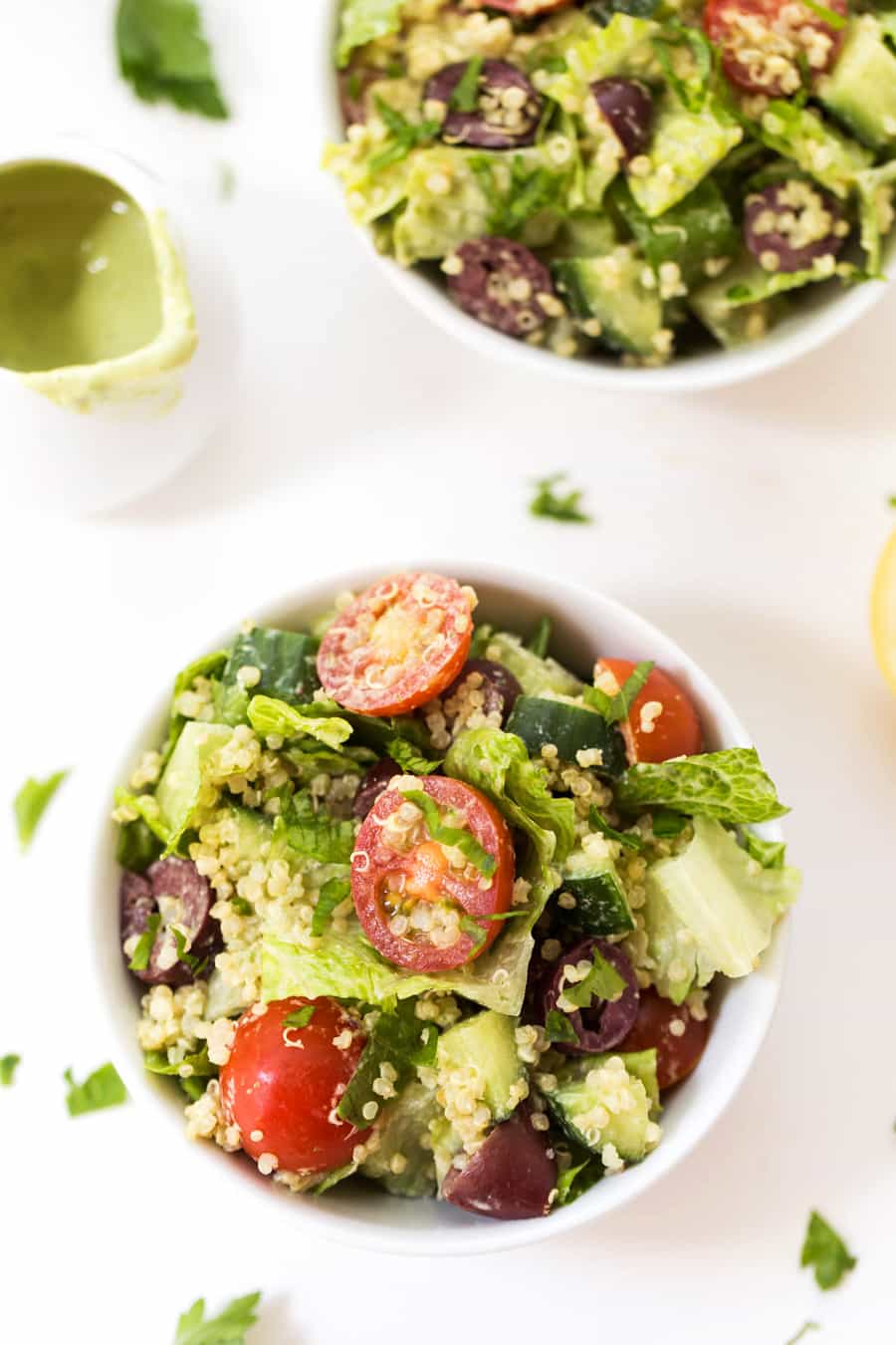 Mediterranean Quinoa Salad -- with juicy tomatoes, crunch cucumbers and big, bold flavor from the tahini dressing, this salad has become my GO-TO dinner this summer!
