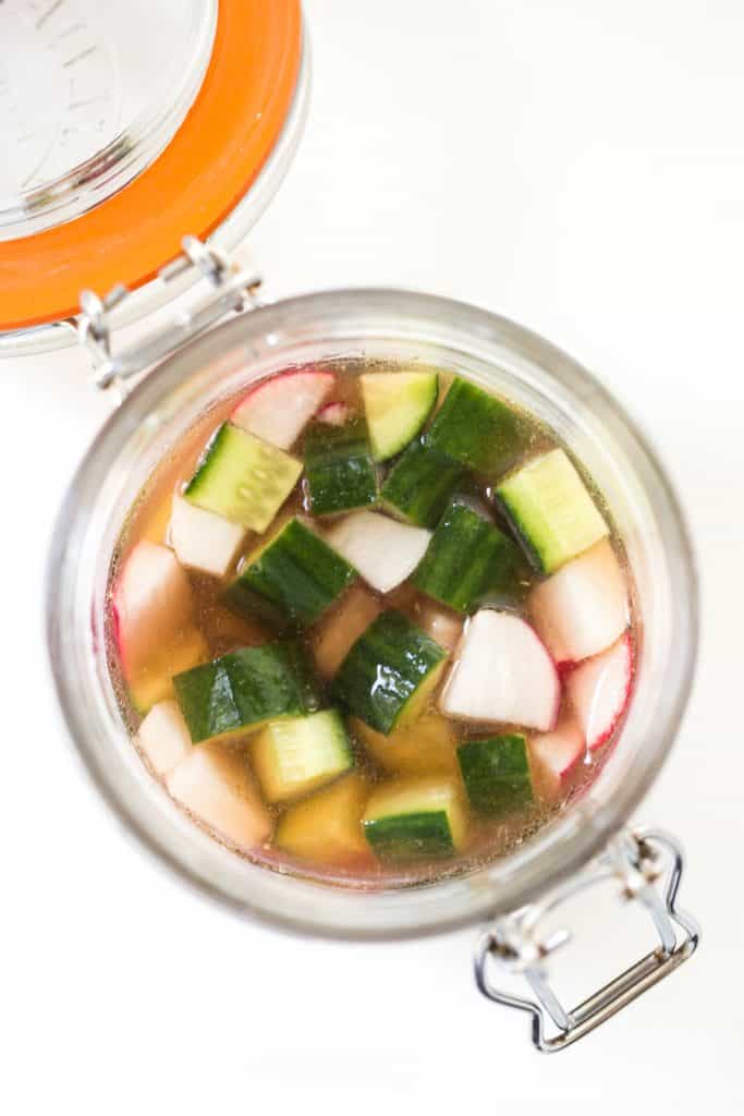 Quick Pickled Veggies with cucumbers, radishes and rice vinegar in jar