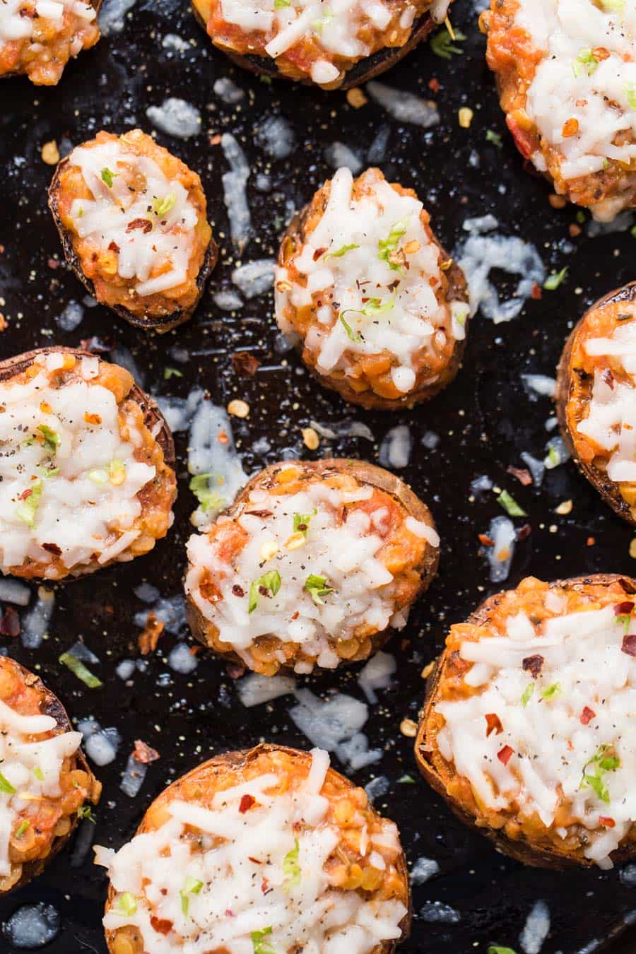 The healthiest twist on pizza ever! These sweet potato pizza bites are perfectly roasted, then topped with a lentil bolognese for a little perfect appetizer!