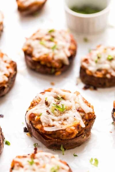 These MINI Sweet Potato Pizza Bites are topped with an amazing lentil bolognese sauce and shredded cheese!