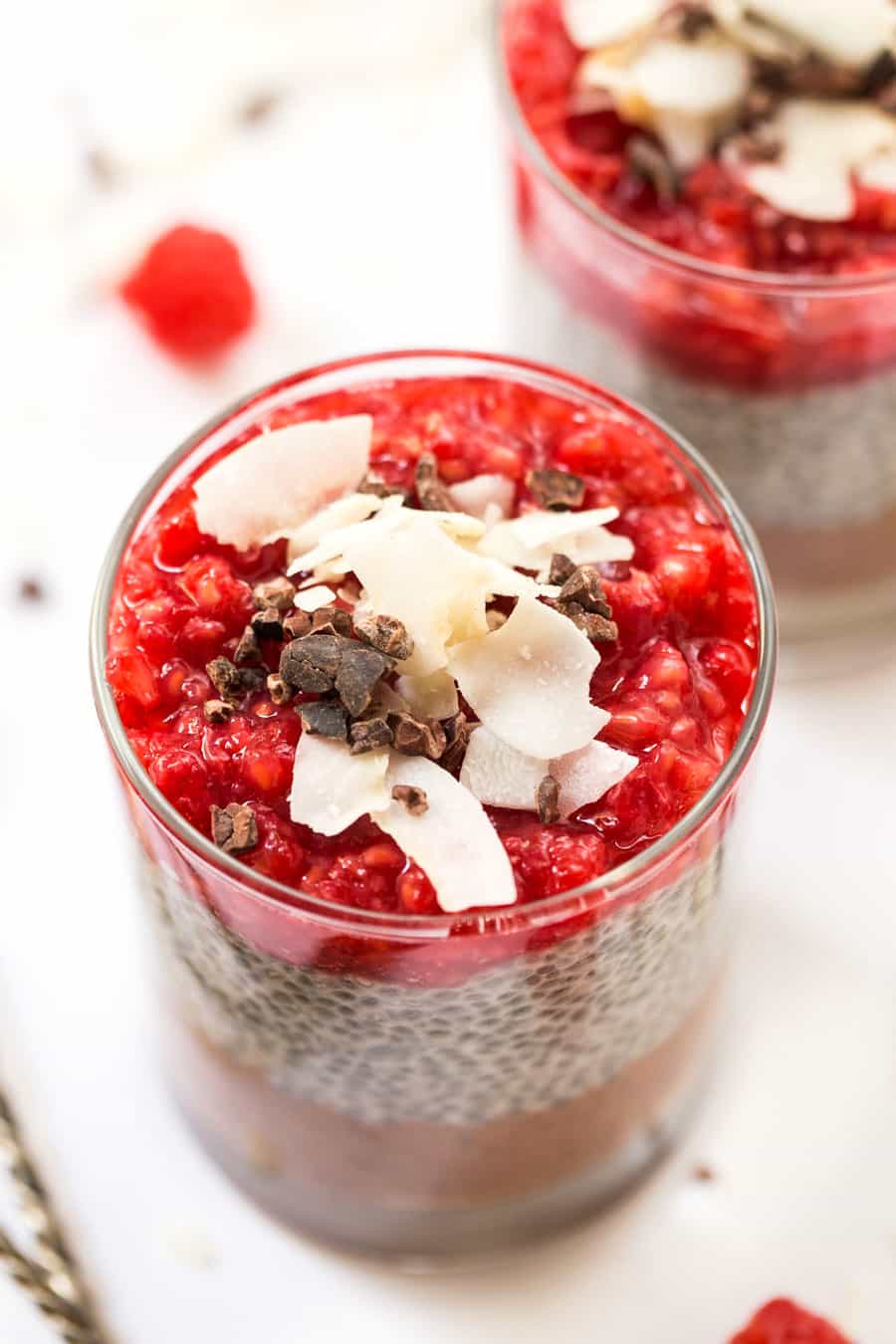 This HEALTHY & DELICIOUS Layered Chia Parfaits have chocolate, chia pudding and a raspberry topping!