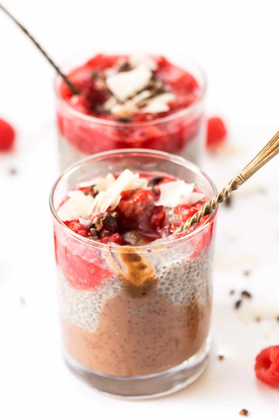 This HEALTHY & DELICIOUS Layered Chia Parfaits have chocolate, chia pudding and a raspberry topping!