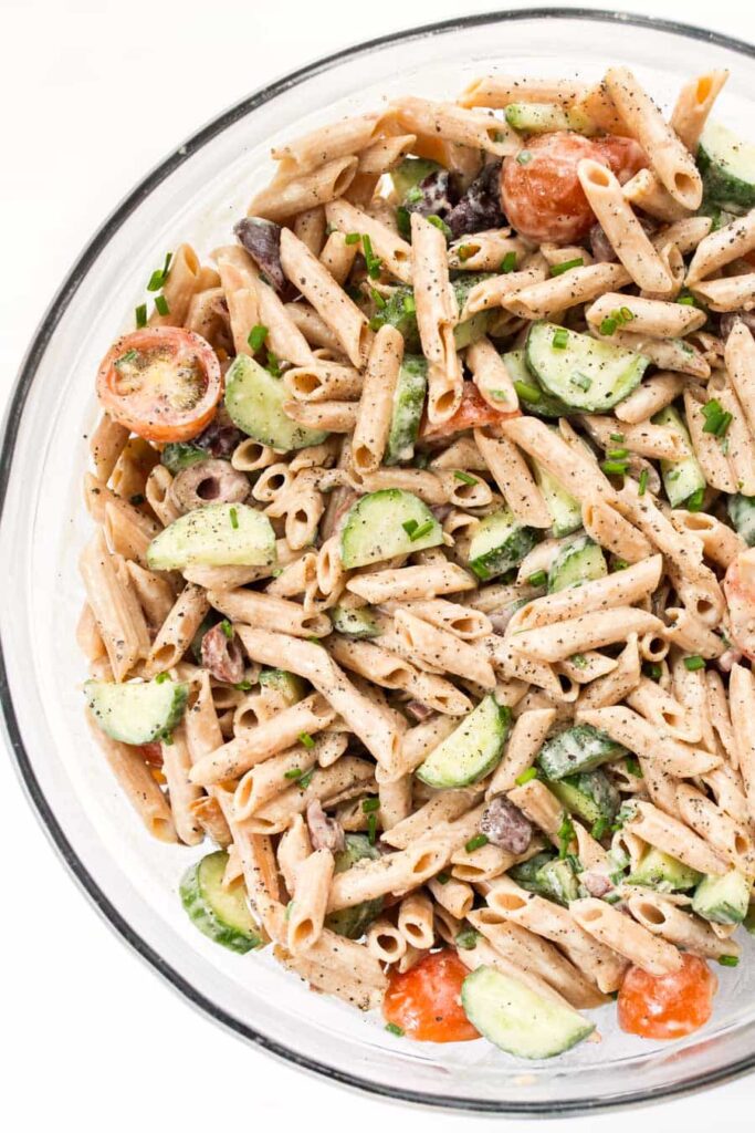 creamy mediterranean pasta salad with hummus and olives