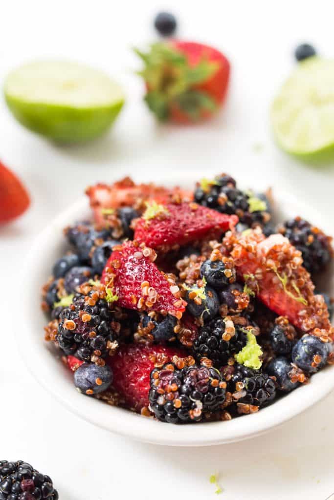 This TRIPLE BERRY QUINOA SALAD is tossed in a maple lime dressing and makes the perfect summer dessert (or breakfast!)
