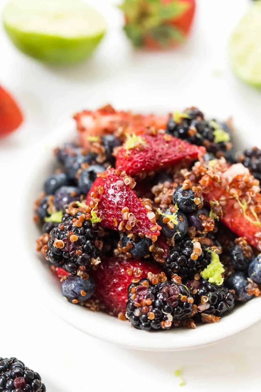 This AMAZING Triple Berry Quinoa Salad is made in under 10 minutes, with only 7 ingredients AND it's naturally GF & VEGAN!