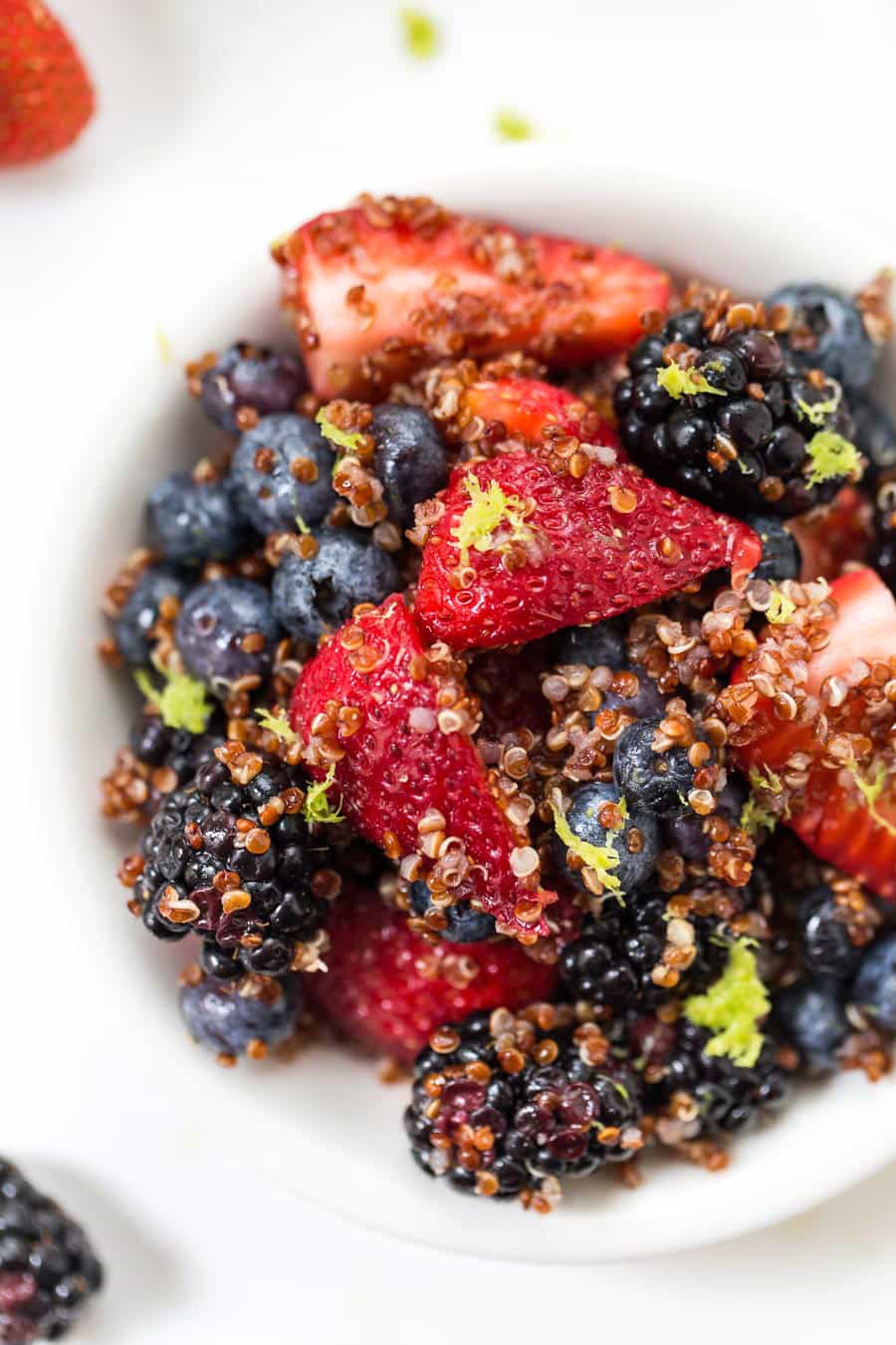 This AMAZING Triple Berry Quinoa Salad is made in under 10 minutes, with only 7 ingredients AND it's naturally GF & VEGAN!