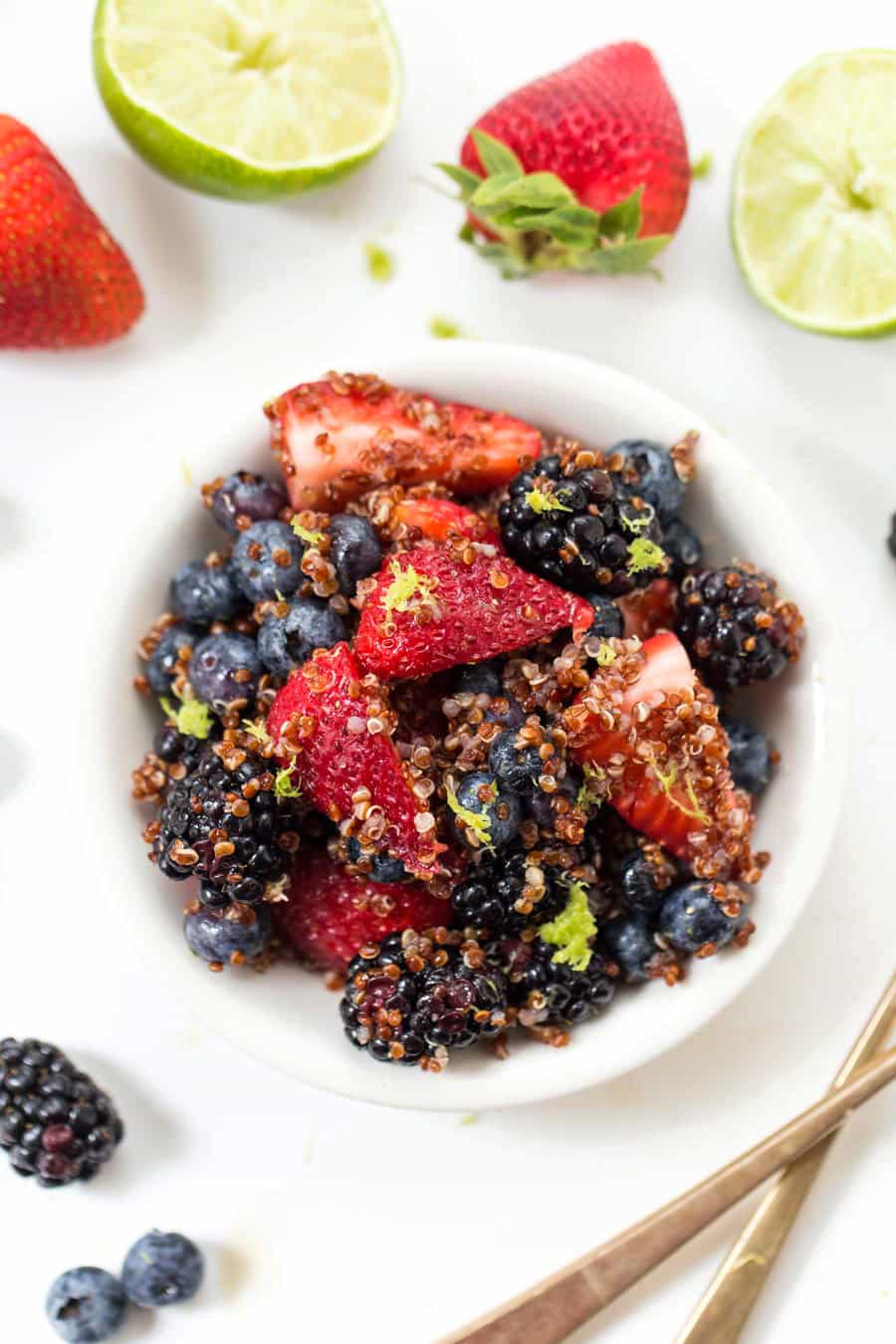 This AMAZING Triple Berry Quinoa Salad is made in under 10 minutes, with only 7 ingredients AND it's naturally GF & VEGAN!