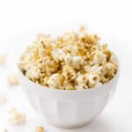 The BEST Vegan Popcorn! Made with just a few simple ingredients and packed with cheesy flavor!