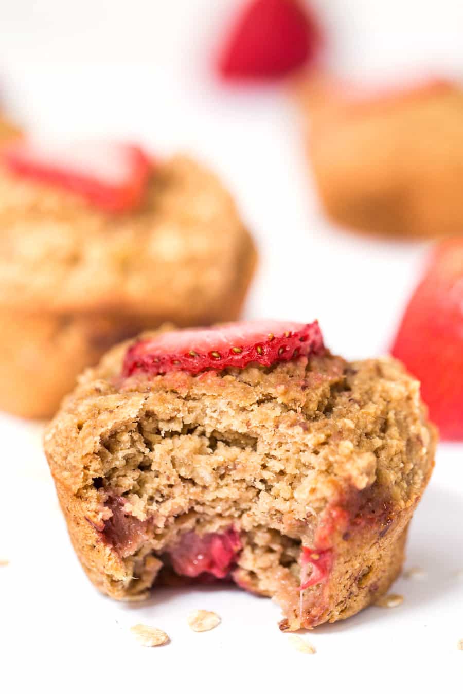 Eating Healthy Oatmeal Muffins With Banana and Strawberry