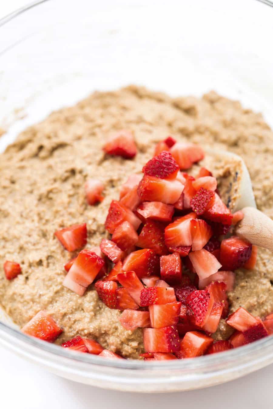 Vegan Banana Oatmeal Muffin Batter With Strawberries Mixed in