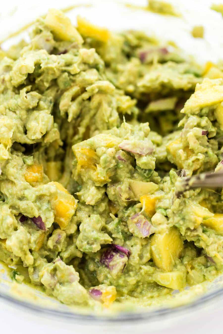 Spicy Mango Guacamole -- made with less than 10 ingredients, it makes the best dip, spread AND toast topper!