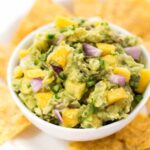 spicy mango guacamole with cilantro and onion