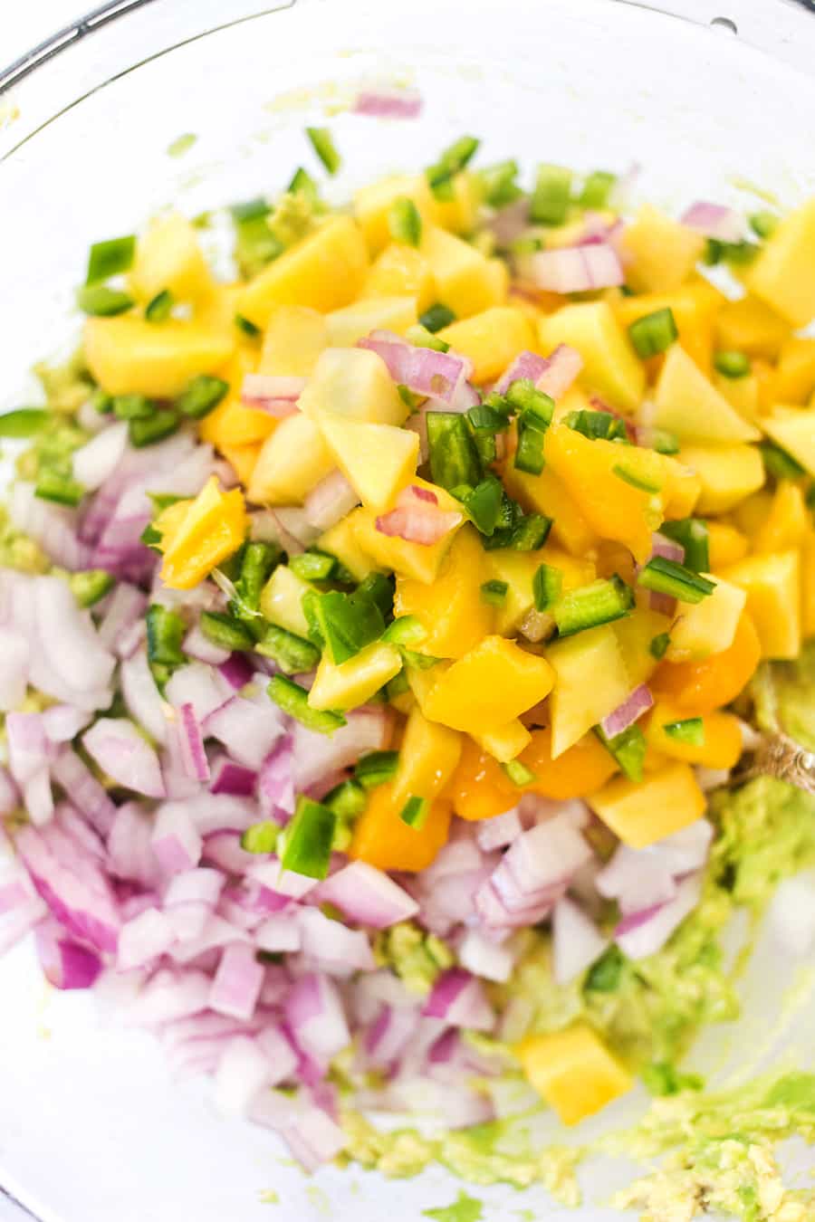 Spicy Mango Guacamole -- made with less than 10 ingredients, it makes the best dip, spread AND toast topper!