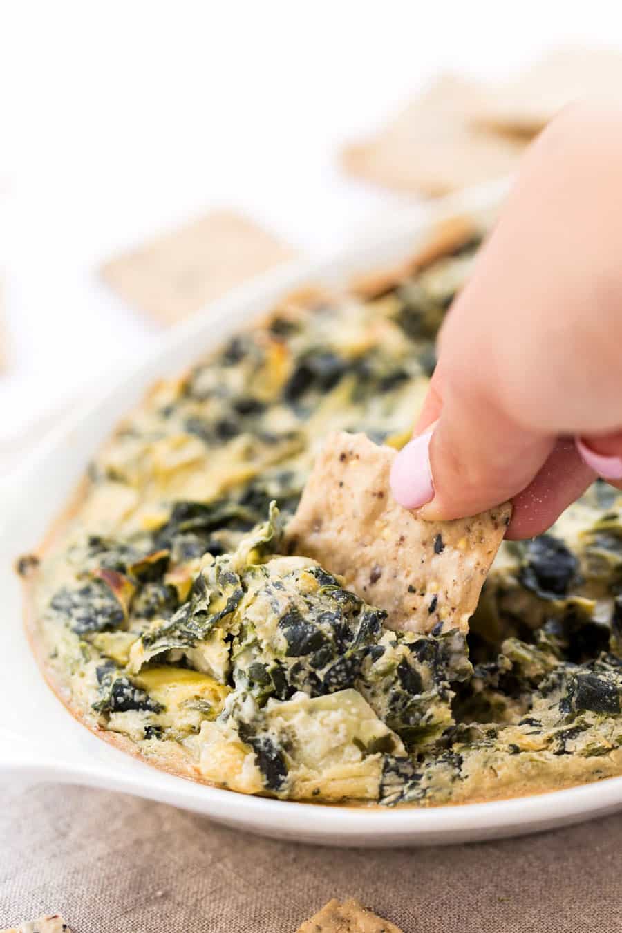 The most INSANELY DELICIOUS Vegan Spinach Artichoke Dip! Less than 10 ingredients, 30 mins and tastes so cheesy!