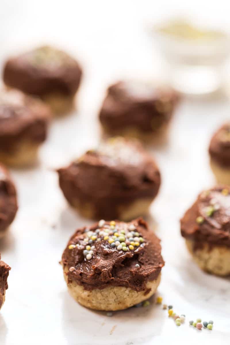 These CHEWY Almond Flour Sugar Cookies are grain-free, vegan and topped with a super healthy chocolate frosting!