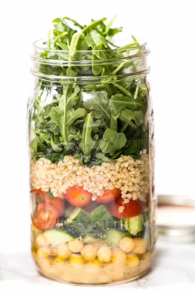 Chickpea & Quinoa MASON JAR SALADS -- perfect for a healthy office lunch! Add everything into your jar, dump into a bowl and enjoy!